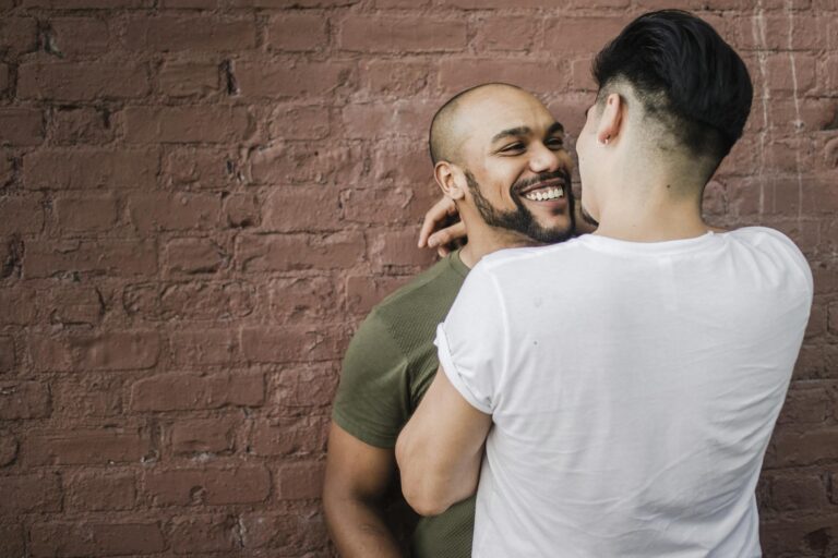 Man in White Shirt Standing in Front of Another Man